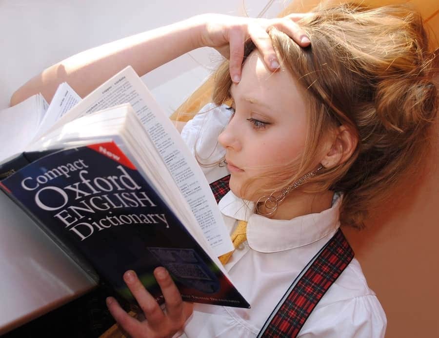 child reading the dictionary